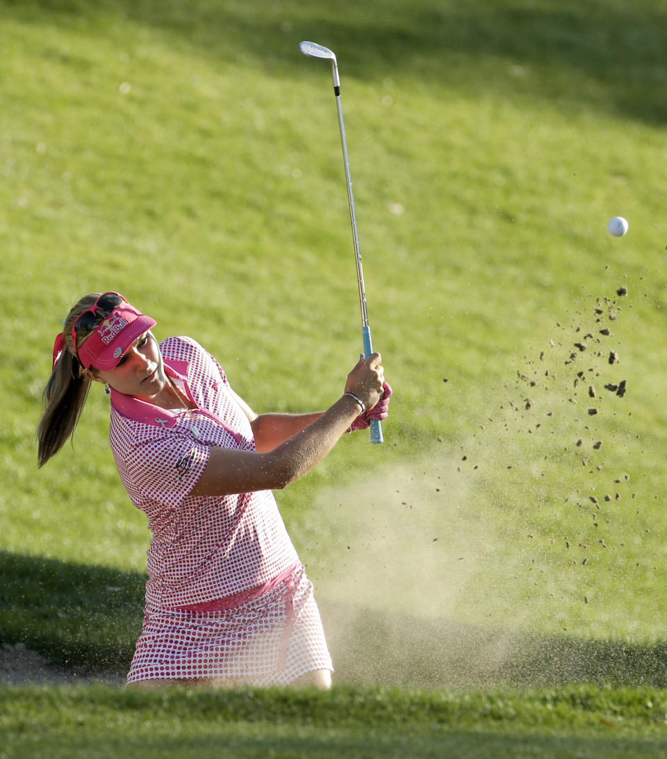 Lexi Thompson watches her bunker shot on the 17th hole during the third round of the Kraft Nabisco Championship golf tournament on Saturday, April 5, 2014, in Rancho Mirage, Calif. (AP Photo/Chris Carlson)