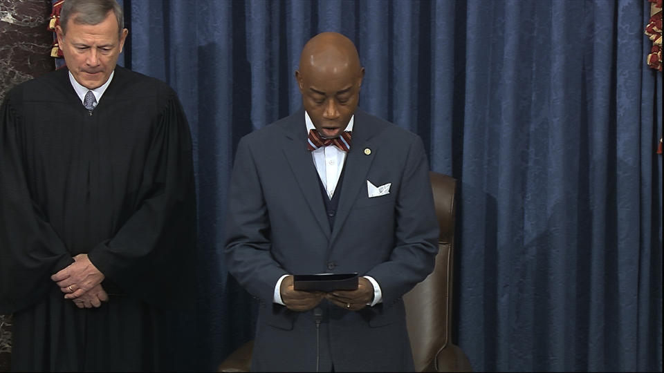 In this image from video, as presiding officer Chief Justice of the United States John Roberts listens, Senate chaplain retired Navy Adm. Barry Black gives the invocation during the impeachment trial against President Donald Trump in the Senate at the U.S. Capitol in Washington, Thursday, Jan. 30 2020. (Senate Television via AP)