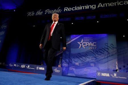 U.S. President Donald Trump takes the stage to address the Conservative Political Action Conference (CPAC) in Oxon Hill, Maryland, U.S. February 24, 2017. REUTERS/Jonathan Ernst