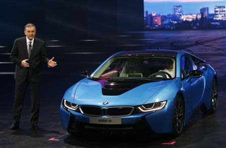 BMW CEO Norbert Reithofer presents the BMW i8 hybrid supercar during a media preview day at the Frankfurt Motor Show (IAA) September 10, 2013. REUTERS/Ralph Orlowski