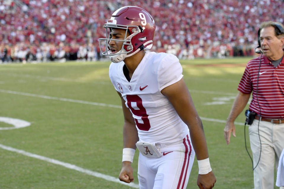 Alabama quarterback Bryce Young (9) talks to his team from the sidelines after leaving the game with an injury during the second half of an NCAA college football game against Arkansas, Saturday, Oct. 1, 2022, in Fayetteville, Ark. (AP Photo/Michael Woods)