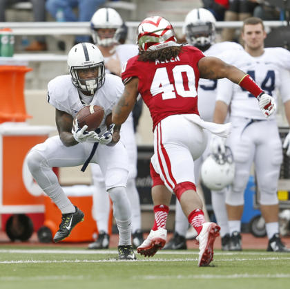 Penn State wide receiver DaeSean Hamilton (5) hauls in a pass during the first quarter against Indiana safety Antonio Allen (40) in an NCAA college football game in Bloomington, Ind., Saturday, Nov. 8, 2014. (AP Photo/Sam Riche)