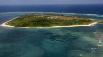 This file photo taken on July 20, 2011 shows an aerial view of Thitu island, part of the disputed Spratly Islands, in the South China Sea. A handful of marines living on a World War II-era ship that is grounded on a remote, tiny reef is the Philippines' last line of defence against China's efforts to control most of the South China Sea