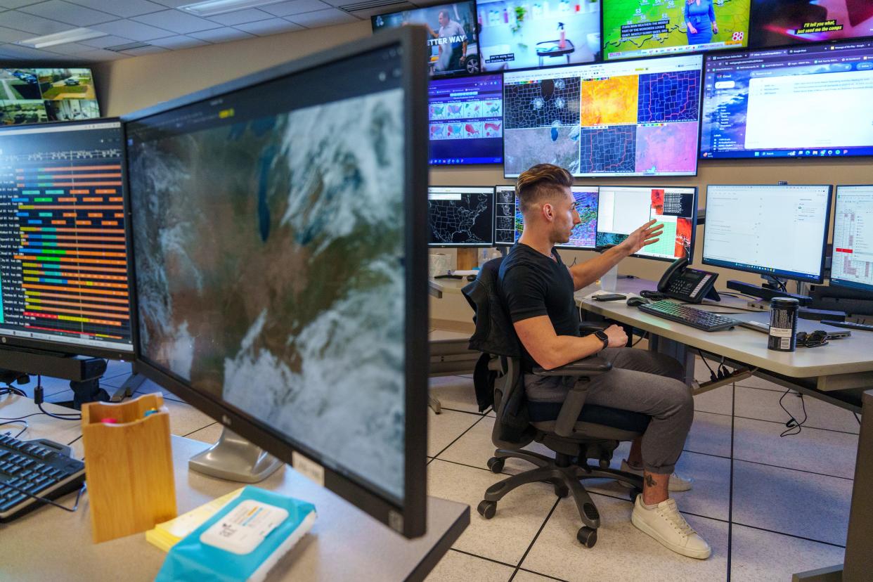 Cody Moore, a meteorologist who's also bilingual, trains an artificial intelligence program to better translate weather advisories in Spanish on Wednesday, Nov. 15, 2023, at the National Weather Service office in Indianapolis.