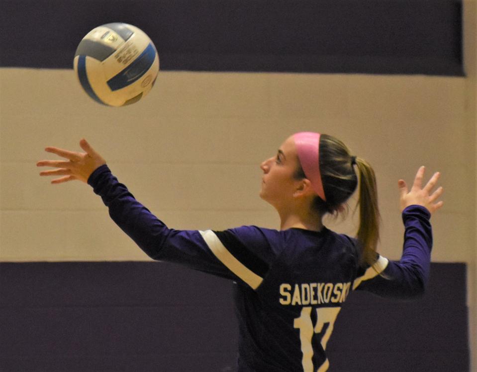 Little Falls Mountie Anna Sadekoski steps into her serve against the Sauquoit Valley Indians Wednesday.