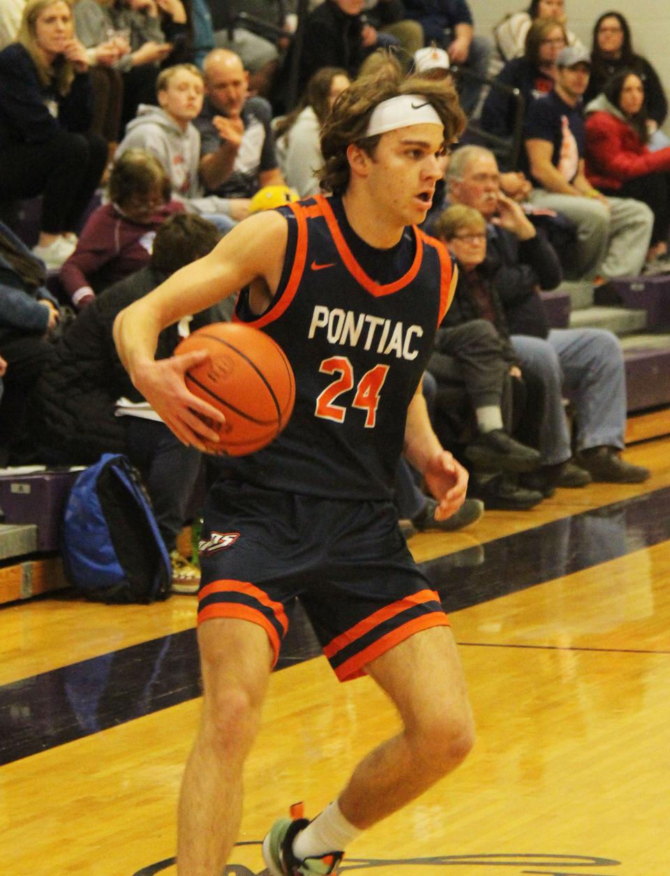 Pontiac's Kerr Bauman pulls up and surveys the situation during the first half of the Indians' game with New Berlin Saturday. Bauman hit a game-winning 3-pointer at the buzzer to lift the Tribe to a 43-40 victory.
