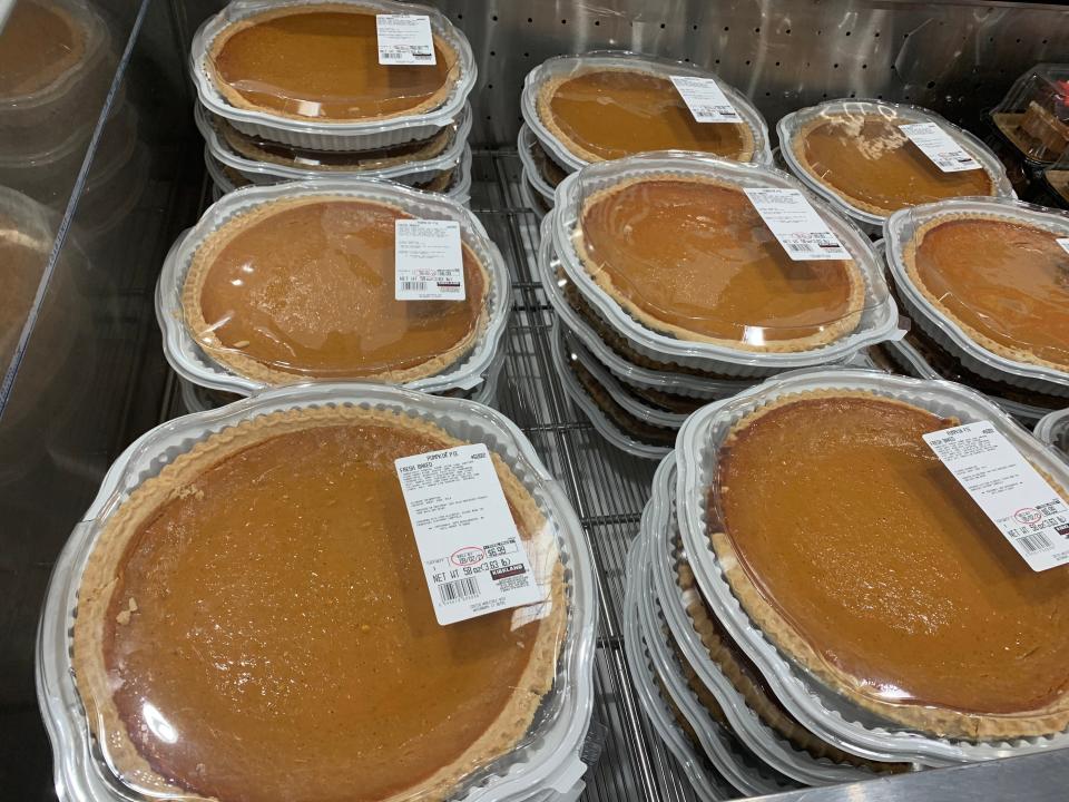 pumpkin pies stacked in a cooler at costco