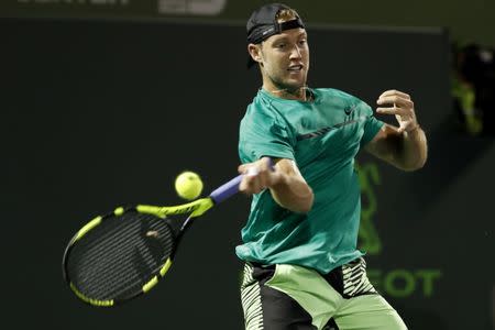 Mar 29, 2017; Miami, FL, USA; Jack Sock of the United States hits a forehand against Rafael Nadal of Spain (not pictured) on day nine of the 2017 Miami Open at Crandon Park Tennis Center. Nadal won 6-2, 6-3. Mandatory Credit: Geoff Burke-USA TODAY Sports