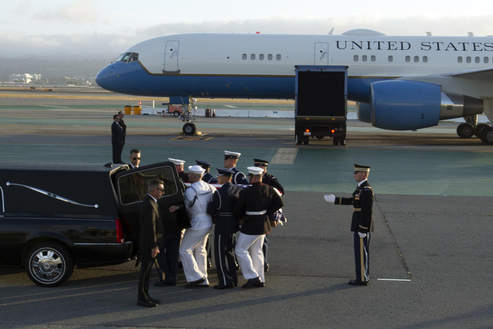 An armed forces color guard loads the body of U.S. Sen. Dianne Feinstein, D-Calif., into a hearse at San Francisco International Airport, Saturday, Sept. 30, 2023, in San Francisco. (AP Photo/D. Ross Cameron)