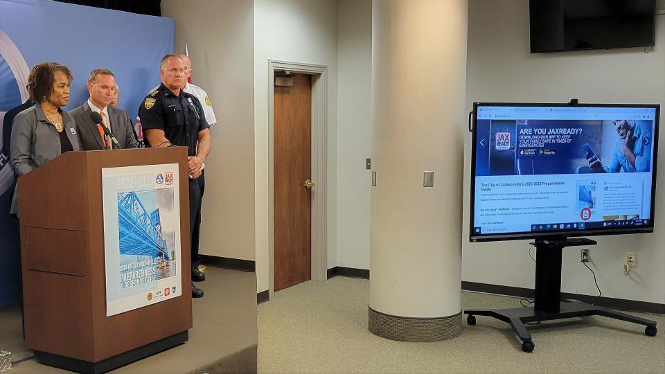 JEA Chief Operating Officer Raynetta Marshall (left), alongside Jacksonville Mayor Lenny Curry and Undersheriff Pat Ivey talks about hurricane season preparations as the city's jaxready.com emergency preparedness website is shown on a screen.