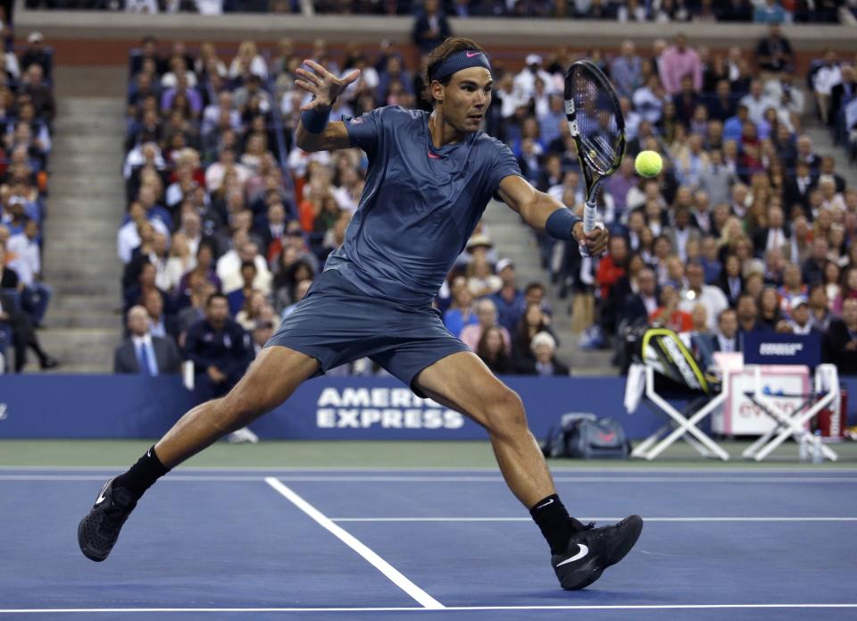 Nadal of Spain hits a return to Djokovic of Serbia in their men's final match at the U.S. Open tennis championships in New York