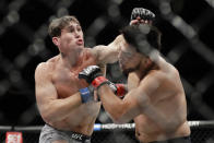 Britain's Darren Till, left, punches Kelvin Gastelum during the second round of a middleweight mixed martial arts bout at UFC 244 on Saturday, Nov. 2, 2019, in New York. Till won the fight. (AP Photo/Frank Franklin II)