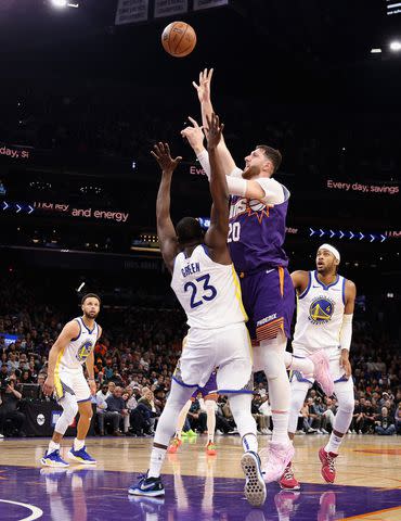 <p>Christian Petersen/Getty</p> Draymond Green and Jusuf Nurkic