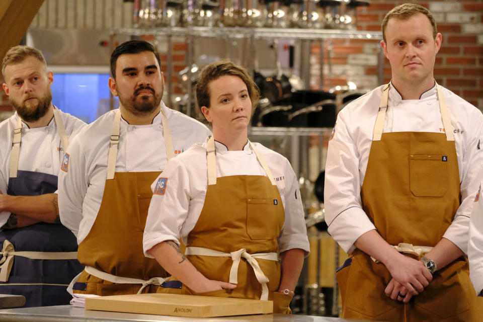 Luke Kolpin, Robert Hernandez, Sarah Welch, and Jackson Kalb stand in a kitchen