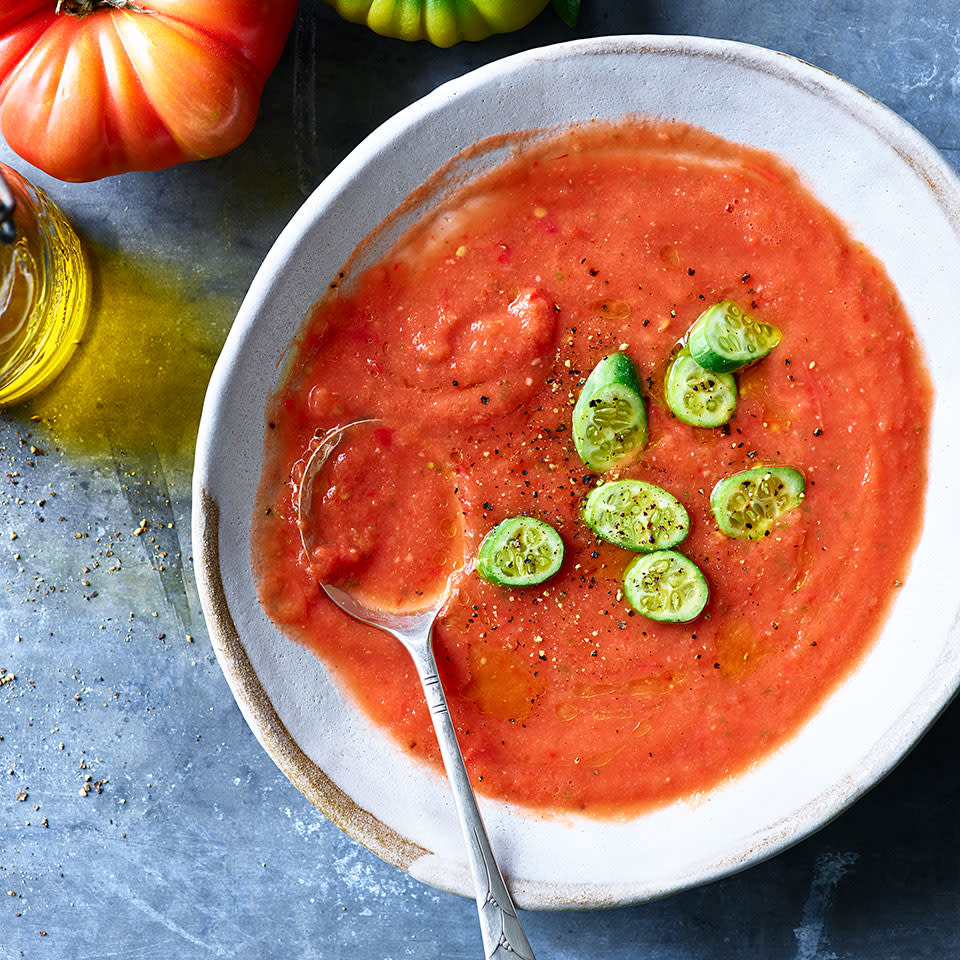 <p>This easy gazpacho recipe is a great way to use less-than-beautiful-but-still-great-tasting tomatoes since they get whirled up in a food processor. The chilled soup is served here with Mexican sour gherkins--bite-size cucumbers that look like mini watermelons and have a slightly sour flavor. Look for them at your farmers' market. <a href="https://www.eatingwell.com/recipe/274154/summer-tomato-gazpacho/" rel="nofollow noopener" target="_blank" data-ylk="slk:View Recipe" class="link ">View Recipe</a></p>