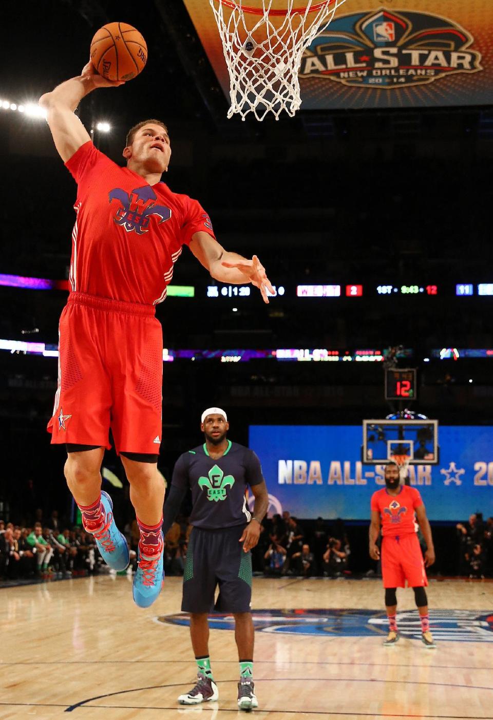 West Team's Blake Griffin, of the Los Angeles Clippers (32) heads to the hoop as East Team's LeBron James, of the Miami Heat (6) looks on during the NBA All Star basketball game, Sunday, Feb. 16, 2014, in New Orleans. (AP Photo/Christian Petersen, Pool)