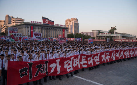 Students march during a mass rally on Kim Il-Sung sqaure in Pyongyang on September 23, 2017 - Credit:  KIM WON-JIN/AFP