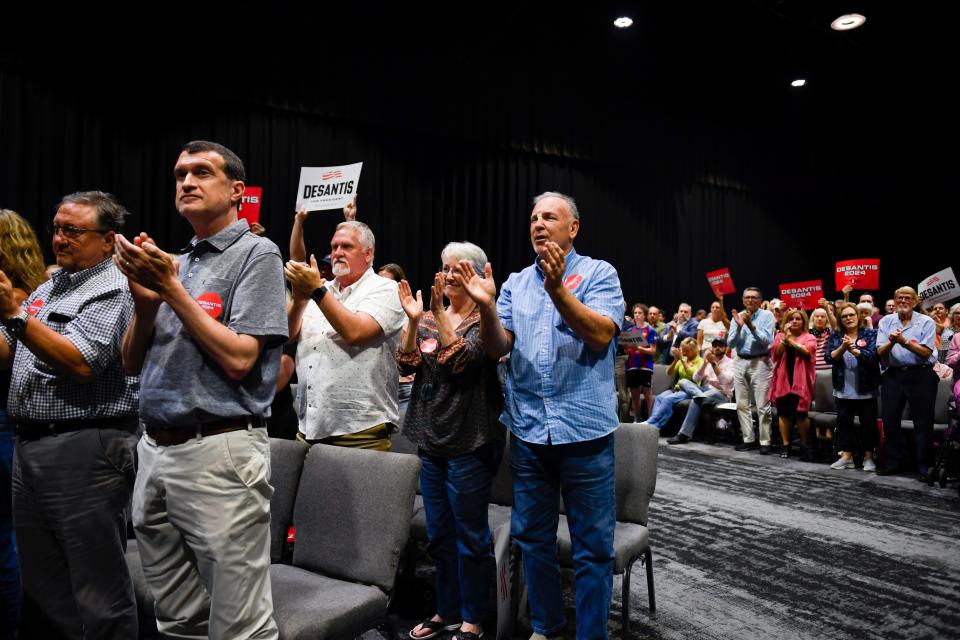 People cheer as Florida Governor and presidential candidate Ron DeSantis speaks at the Greenville Convention Center on Friday, June 2, 2023.  