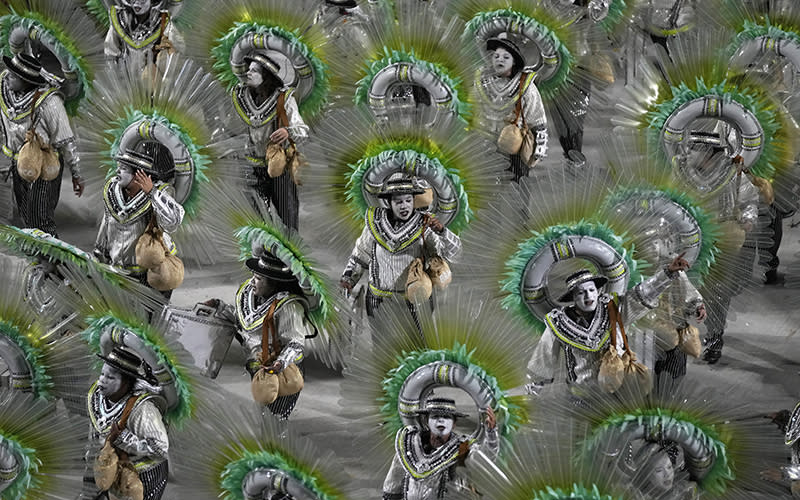 Performers from the Beija Flor samba school parade during Carnival celebrations