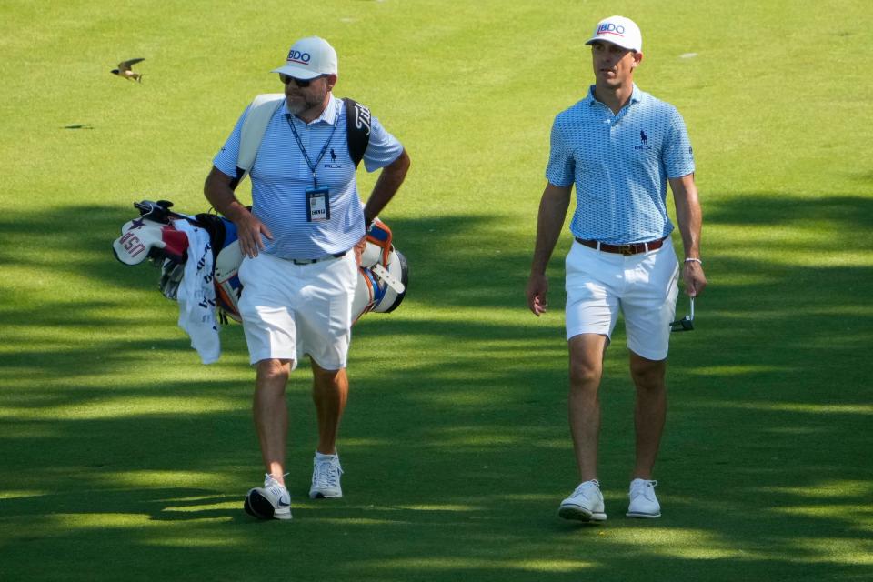 May 30, 2023; Dublin, Ohio, USA;  Billy Horschel walks the ninth fairway with his caddie Mark Fulcher during a practice round for the Memorial Tournament at Muirlfield Village Golf Club. 