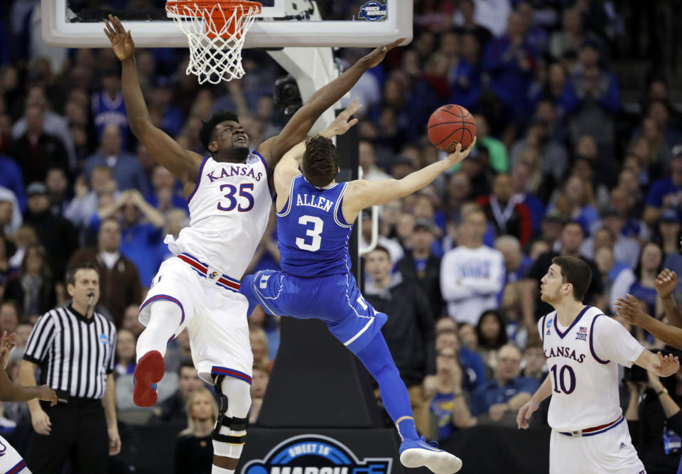 Duke’s Grayson Allen (3) is unable to score past Kansas’ Udoka Azubuike as Kansas’ Sviatoslav Mykhailiuk watches during the second half of a regional final game in the NCAA men’s college basketball tournament Sunday, March 25, 2018, in Omaha, Neb. (AP Photo/Charlie Neibergall)