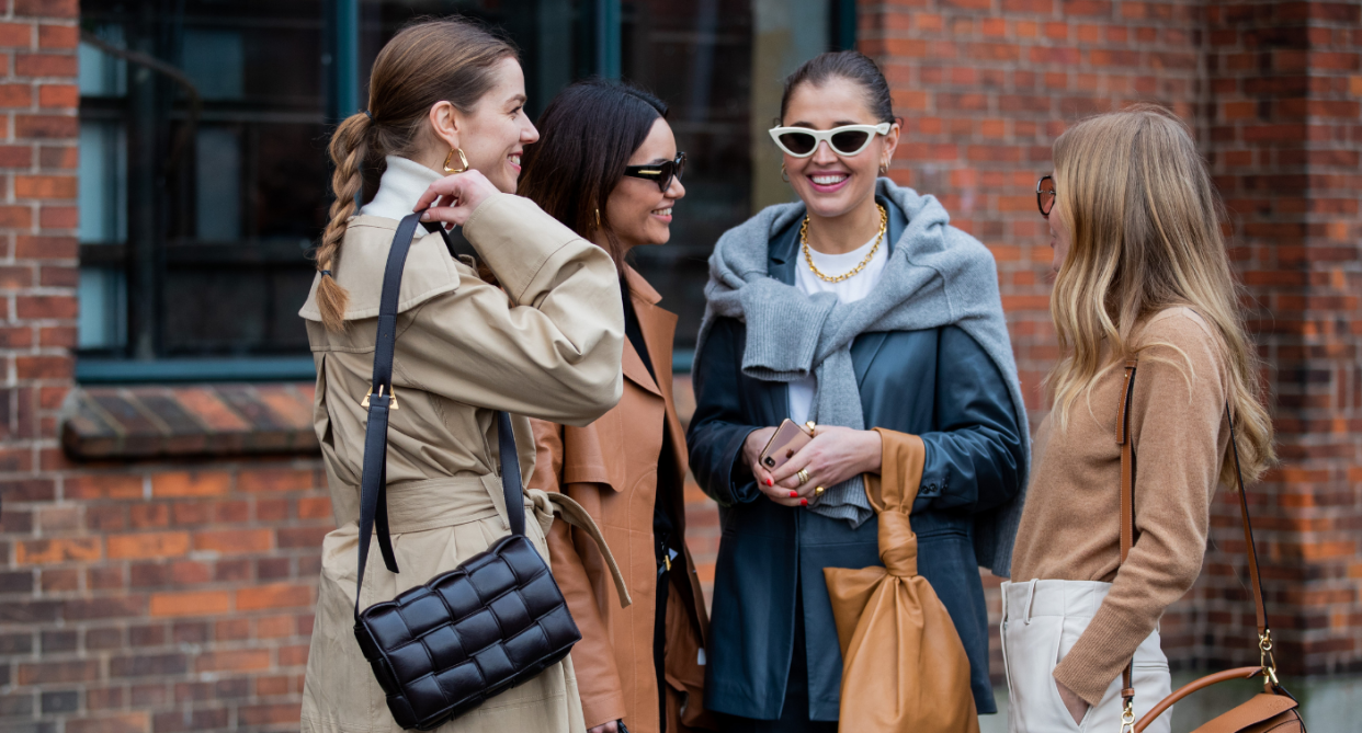 four women standing in group, street style, nordstrom canada designer sale