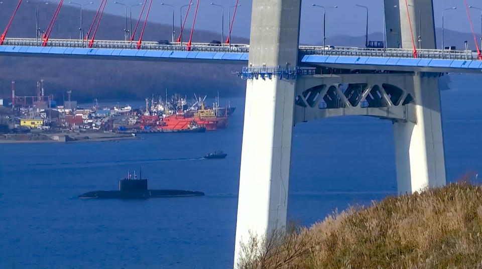 In this handout photo taken from video released by Russian Defense Ministry Press Service on Friday, April 14, 2023, A Russian submarine sails off to take part in the Pacific Fleet drills near Vladivostok, Russia. Russian Defense Minister Sergei Shoigu announced that the entire Russian Pacific Fleet was put on high alert on Friday for snap drills that will involve practice missile launches in a massive show of force amid the tensions with the West over the fighting in Ukraine. (Russian Defense Ministry Press Service via AP)