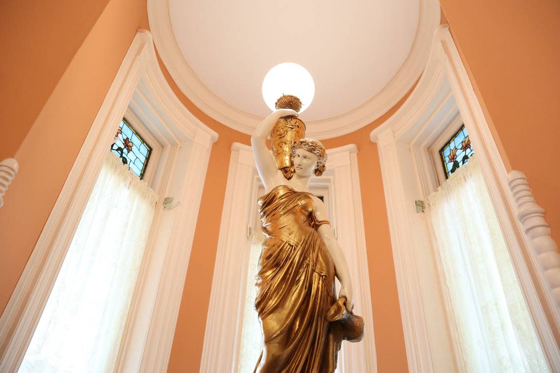 An ornate lamp sits in the main parlor of Burke Mansion on Monday, Aug. 5, 2024, in Macon, Georgia. “Merchant Prince” of Macon T.C.Burke built the home in 1887, which has now been converted into a bed and breakfast.