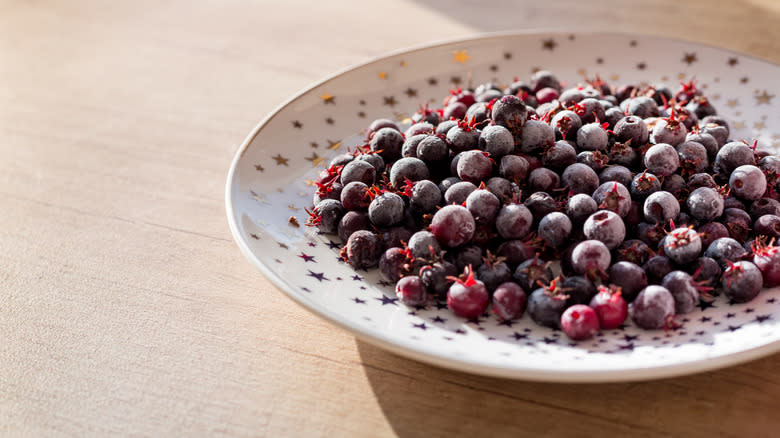 Frozen serviceberries on plate