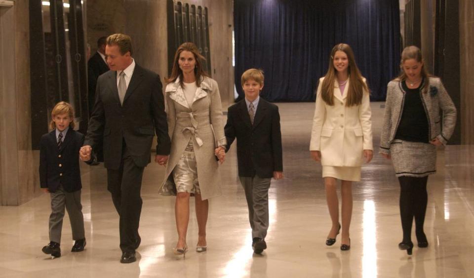 Arnold Schwarzenegger and his wife Maria Shriver arrive at the inaugural ceremony at the state Capitol on Nov. 17, 2003, with their children Christopher, left, Patrick, center, Katherine and Christina, right.