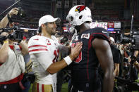 San Francisco 49ers quarterback Jimmy Garoppolo (10) greets Arizona Cardinals linebacker Chandler Jones (55) after an NFL football game, Thursday, Oct. 31, 2019, in Glendale, Ariz. The 49ers won 28-25. (AP Photo/Rick Scuteri)