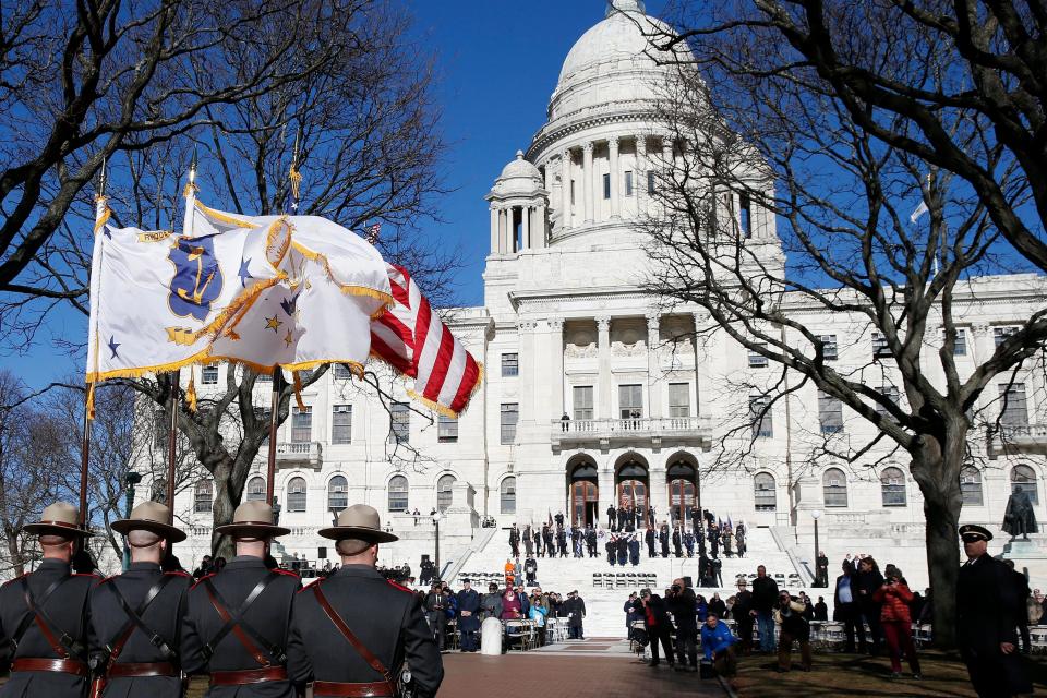 Members of the Rhode Island State Police lead the inauguration procession at the State House in Providence, R.I., on Tuesday, Jan. 1, 2019.