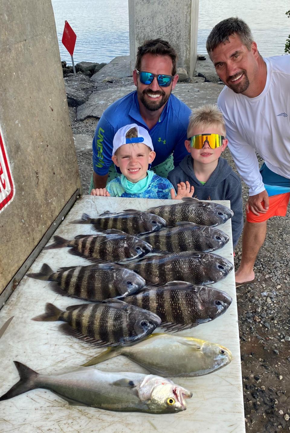 Tommy Clark, Mason Clark, Eli Clark, and Josh Hearn with a table full of quality fare after a day spent with Capt. Jeff Patterson aboard his Pole Dancer charter boat.