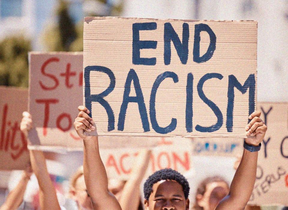 a group of people holding signs