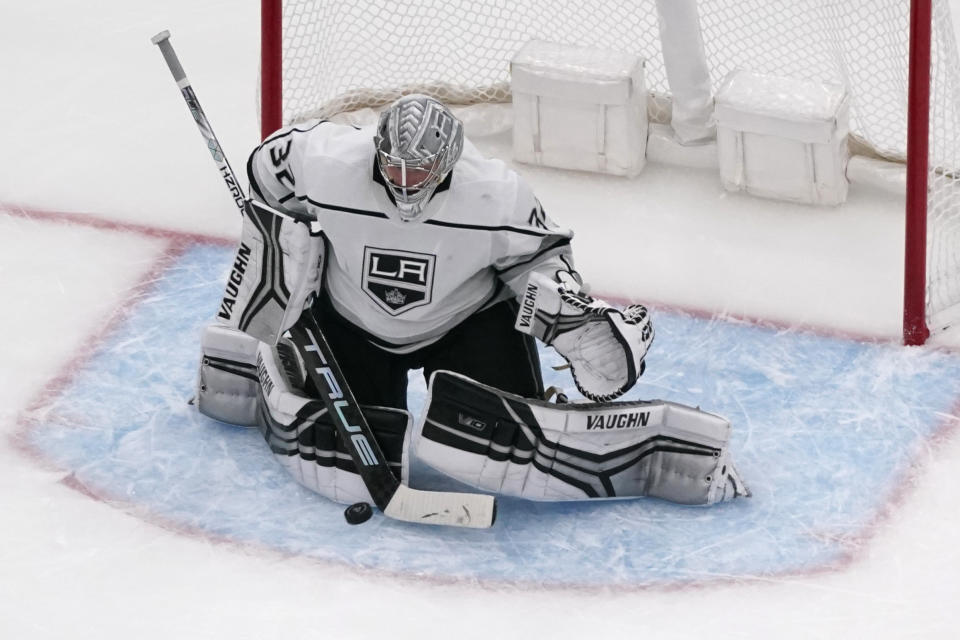 Los Angeles Kings goaltender Jonathan Quick deflects a puck during the third period of an NHL hockey game against the St. Louis Blues Monday, Oct. 31, 2022, in St. Louis. (AP Photo/Jeff Roberson)