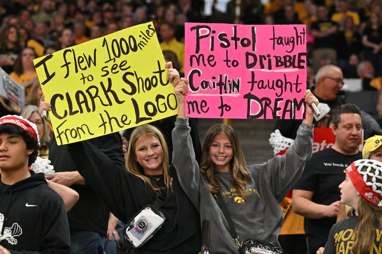 Hawkeye fans show their support of Caitlin Clark and Pete Maravich.