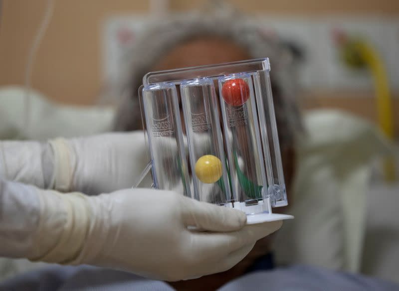 Medical workers treat patients infected with the coronavirus disease (COVID-19) at a hospital in New Delhi