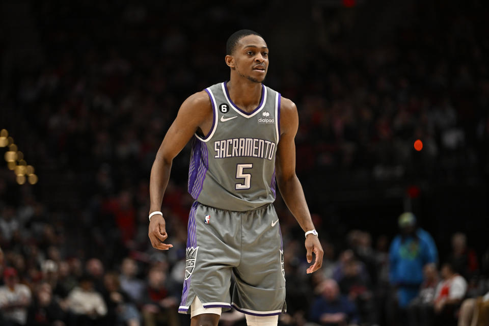 PORTLAND, OREGON - MARCH 29: De'Aaron Fox #5 of the Sacramento Kings looks on during the third quarter against the Portland Trail Blazers at the Moda Center on March 29, 2023 in Portland, Oregon. The Sacramento Kings won 120-80. NOTE TO USER: User expressly acknowledges and agrees that, by downloading and or using this photograph, User is consenting to the terms and conditions of the Getty Images License Agreement. (Photo by Alika Jenner/Getty Images)