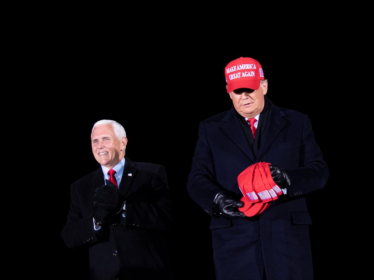 <p>Donald Trump arrives with Mike Pence for his final Make America Great Again rally of the 2020 US Presidential campaign at Gerald R Ford International Airport on 3 November 2020, in Grand Rapids, Michigan</p> ((AFP via Getty Images))