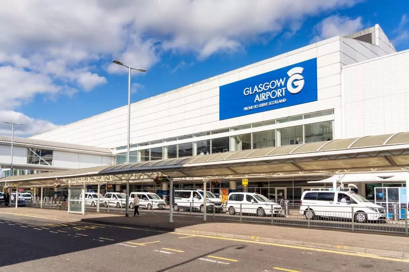 An exterior view of Glasgow Airport's main building, on a sunny day in August.