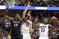 Arizona forward Rondae Hollis-Jefferson (23) pulls down a rebound as teammate Aaron Gordon (11) and San Diego State forward Winston Shepard (13) look over during the first half in a regional semifinal of the NCAA men's college basketball tournament, Thursday, March 27, 2014, in Anaheim, Calif. (AP Photo/Jae C. Hong)