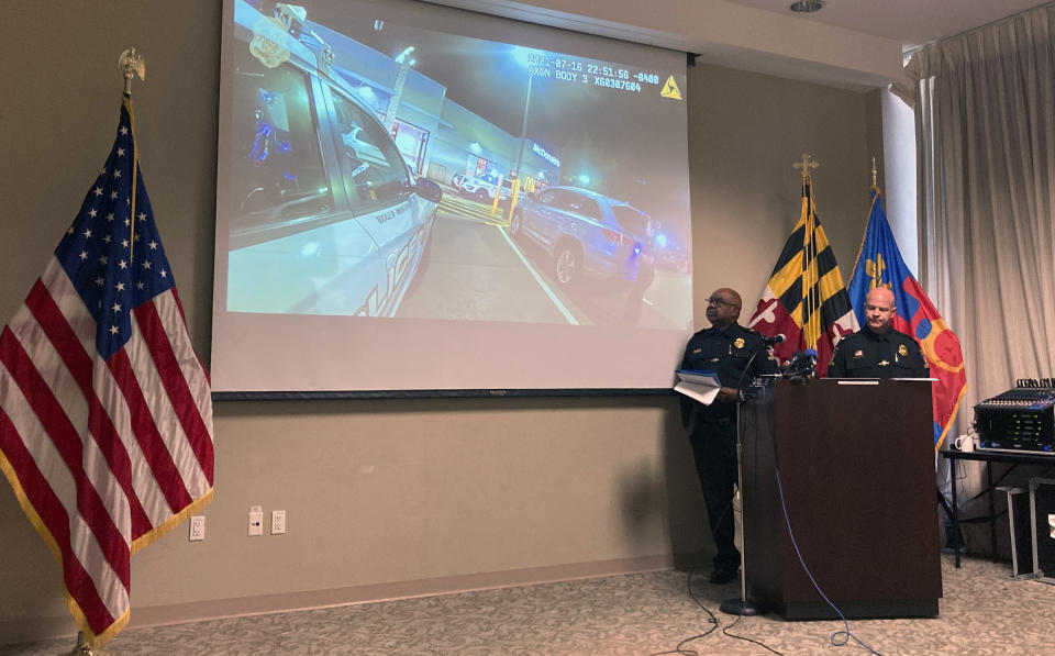 Montgomery County Police Chief Marcus Jones, left, and Assistant Police Chief Darren Francke review an officers’ body camera footage from a fatal police shooting on July 16 at a McDonald’s in Gaithersburg, Md., during a news conference in Gaithersburg, Tuesday, July 27, 2021. (AP Photo/Michael Kunzelman)