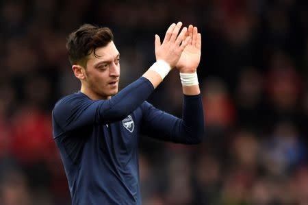 Football Soccer - AFC Bournemouth v Arsenal - Barclays Premier League - Vitality Stadium - 7/2/16 Arsenal's Mesut Ozil applauds fans at the end of the match Reuters / Dylan Martinez Livepic