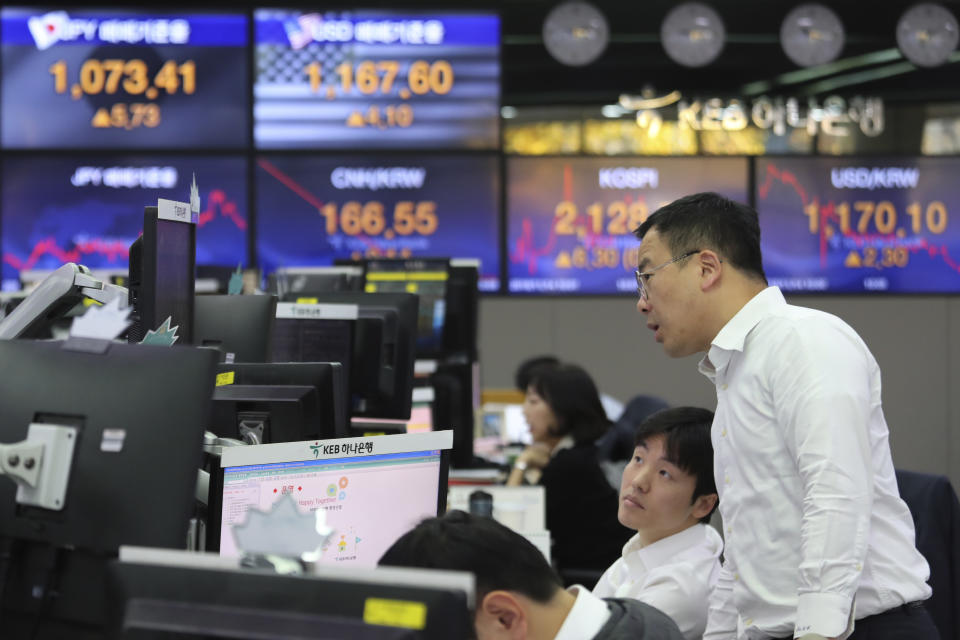 Currency traders watch monitors at the foreign exchange dealing room of the KEB Hana Bank headquarters in Seoul, South Korea, Thursday, Nov. 14, 2019. Asian stock markets were mixed Thursday amid doubts about the status of a U.S.-Chinese trade deal after the U.S. Federal Reserve’s chairman said it is likely to leave its benchmark interest rate unchanged. (AP Photo/Ahn Young-joon)