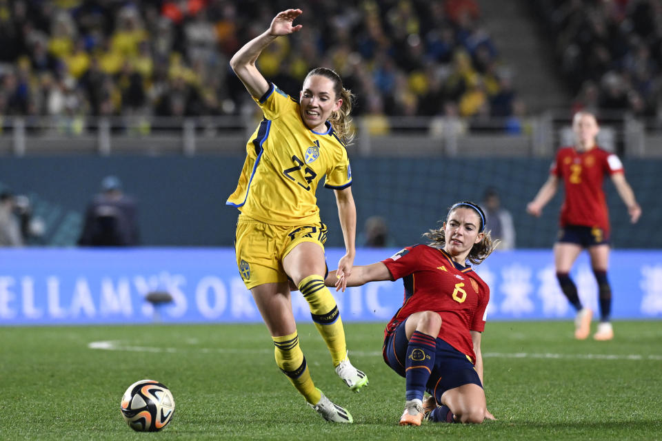 Sweden's Elin Rubensson, left, and Spain's Aitana Bonmati battle for the ball during the Women's World Cup semifinal soccer match between Sweden and Spain at Eden Park in Auckland, New Zealand, Tuesday, Aug. 15, 2023. (AP Photo/Andrew Cornaga)
