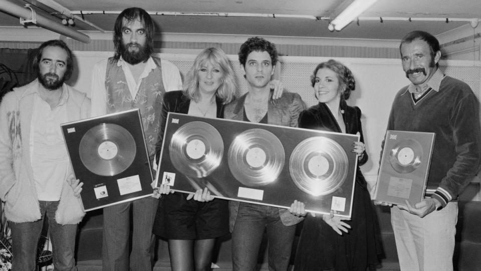 Group of people holding awards; Fleetwood Mac Rumours