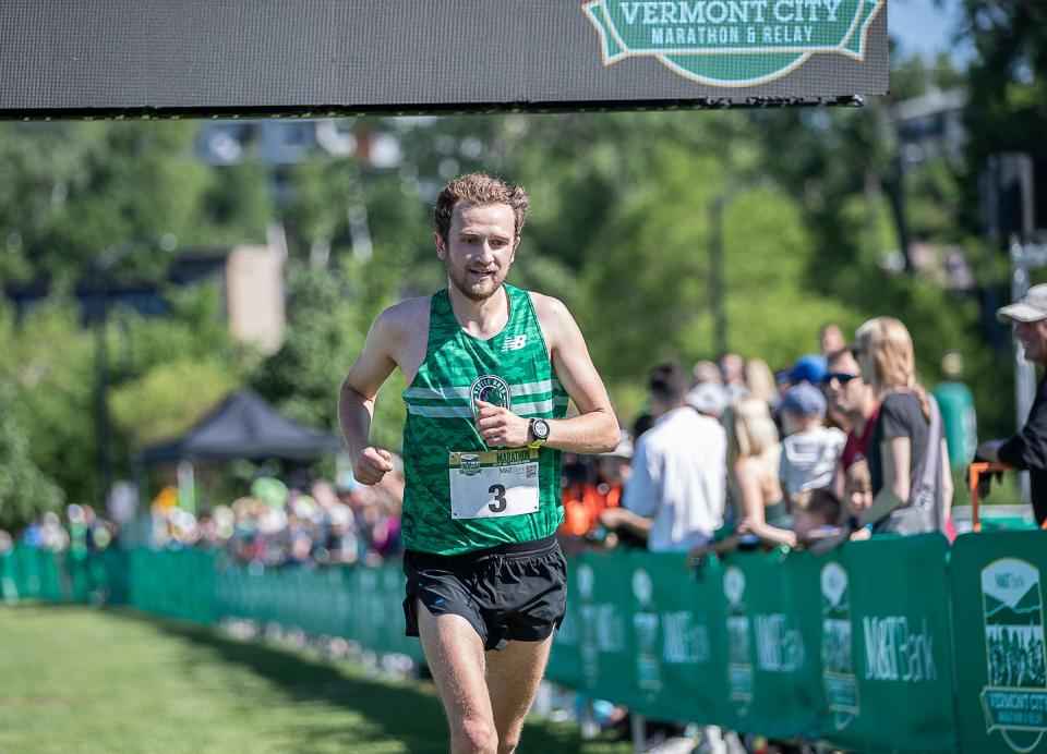 William McGovern from Stowe, VT crosses the finish line of the M&T Bank Vermont City Marathon & Relay.