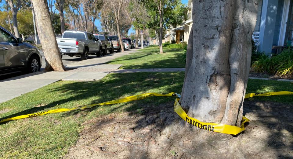 Caution tape marks the 700 block of East Port Hueneme Road in Port Hueneme on Sunday close to the residence where two people were found dead Saturday night.