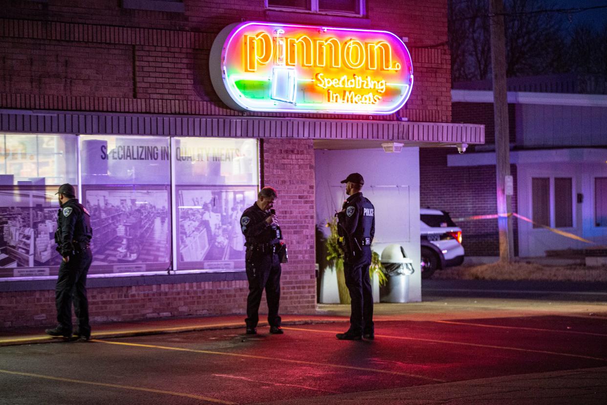 Rockford police officers stand outside Pinnon Meats during a shooting investigation on Wednesday, Jan. 11, 2023, in Rockford.