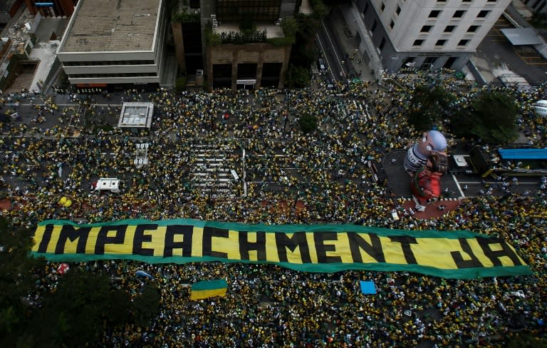 Demonstrators take part in a protest to demand the resignation of Brazilian President Dilma Rousseff, on March 13, 2016 in Sao Paulo